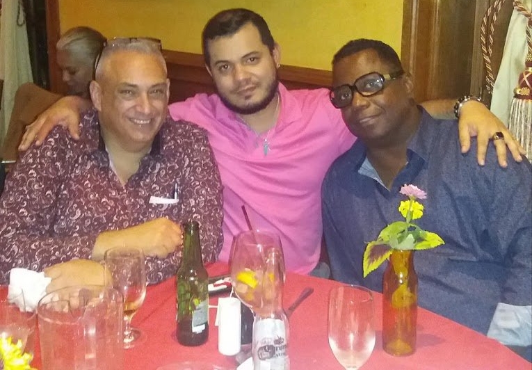 Three attendees of the 2018 NLAAD event gathered around a table.